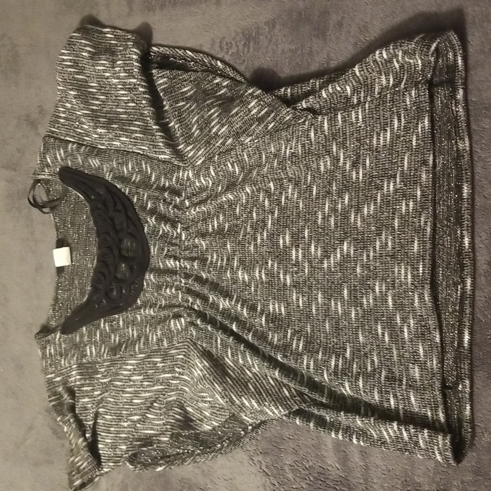 Short sleeve, glittery nice shirt. Black and silver with sparkle. Size medium